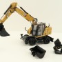 Diecast Masters 85956 - Caterpillar CAT M318 Wheeled Excavator & Attachments High Line - Scale 1:50