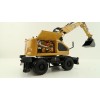 Diecast Masters 85956 - Caterpillar CAT M318 Wheeled Excavator & Attachments High Line - Scale 1:50
